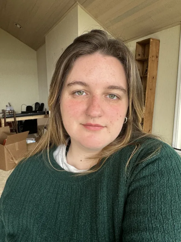 a person in a green sweater