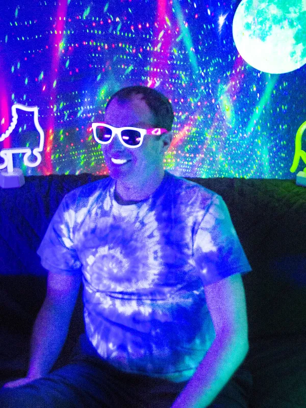 a person in blacklight room